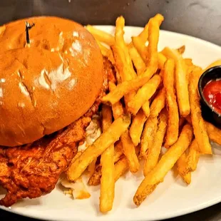 Chicken sandwich with fries.