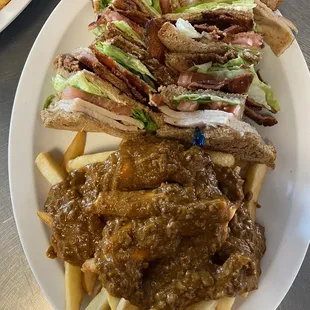Club sandwich and chilli fries w/ sliced cheese