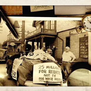 two men standing in front of a car