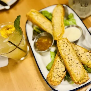 Aji Chicken Eggrolls: Pineapple Marinated Chicken, Aji Amarillo Sauce, Pineapple Sweet Chili Sauce, Confusion Sauce