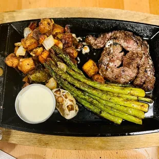 Butchers butter steak: Wood Fired Ribeye Cap Steak, Confusion Potatoes, Grilled Asparagus