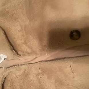 Button off of coat that I received in the mail today from State of Grace Boutique.