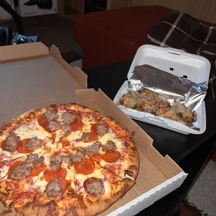 Large Pizza, Pepperoni and Sausage. Garlic Wings