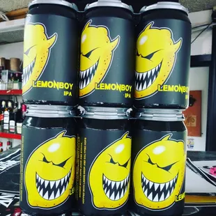 a stack of cans of lemonade