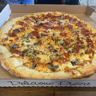 Wonderful pepperoni, sausage , mushroom pizza!