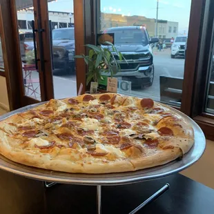 Custom Pepperoni and mushroom pie with white sauce, garlic, ricotta, and mozzarella cheeses - great!