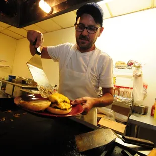 Jimmy Peoni on the grill - Photo by Zachary A. Bell