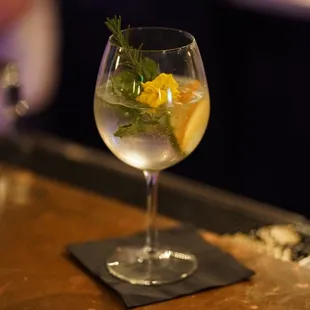 a glass of water with lemon and mint