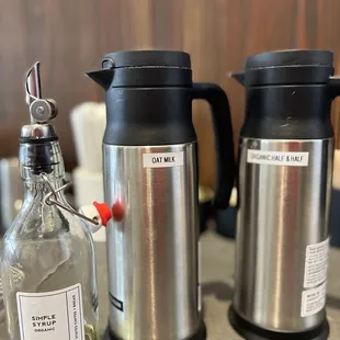 two coffee kettles and a bottle