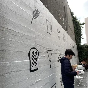 Side alley seating area with cute art