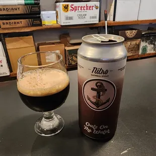 a can and a glass of beer