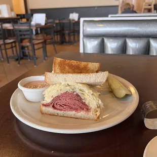 Reuben on jewish rye toasted with dressing on the side.