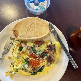 Veggie omelette with bacon and the best darn toast around!