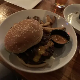 Stateside Burger: 7oz Angus Burger- cheddar- peppercorn aioli-romaine-bacon-bourbon onion jam- pickles- served on brioche