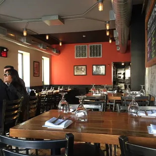 people sitting at tables in a restaurant