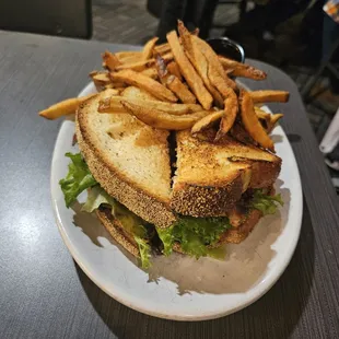 Fried Green B.L.T.  Grilled jalapeño cornbread, fried green tomatoes, bacon, arugula, and chipotle aioli, served with hand-cut fries