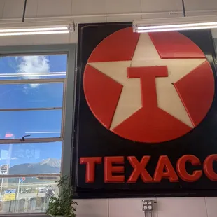 Interior sign with mountains in the background