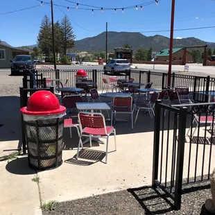 Outdoor seating-shady with several tables
