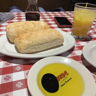 a plate of food and a glass of orange juice