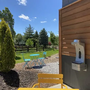 A bit more outdoor seating as well as water and bowl for dogs