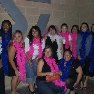 Group posing with the sign at the entrance.