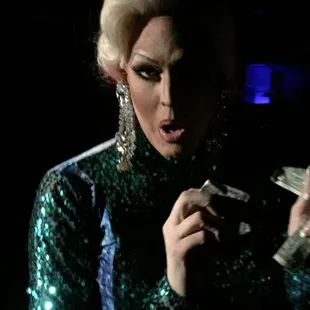 a woman in a green sequinned dress