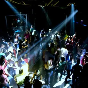 a crowd of people dancing at a party
