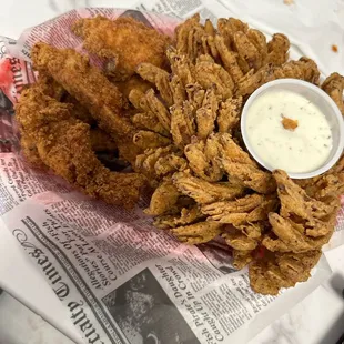 Blooming onion and chicken strip. Amazing food, bbq sauce is fantastic. nice people kiddo with face paint is adorable.