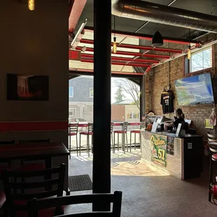 Garage doors open onto Main Street.