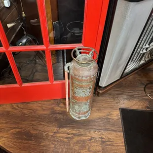 a fire extinguisor on a table