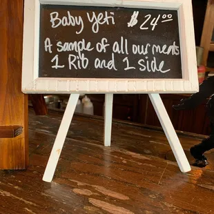 a chalk board with a sign saying baby yet