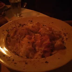 a plate of pasta with meat and vegetables