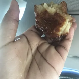 So much oil in the donut, dripping down from my thumb.