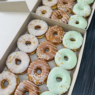 a variety of doughnuts in a box
