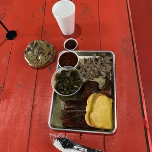 Ribs, chicken, and pulled pork with collard greens and 2 big cookies