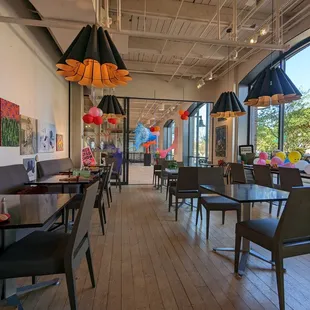 tables, chairs, and artwork