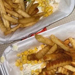 Crispy chicken burger (added cheese), right side with cajun fries, the other, regular.