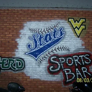 a brick wall with graffiti