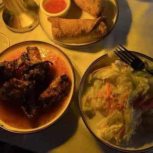 Jerk honey wings, spicy cabbage, and oxtail eggrolls.