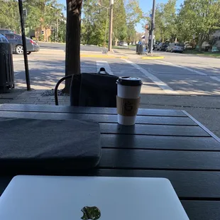 a laptop and a cup of coffee