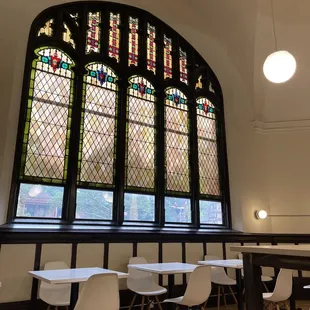 Stained glass windows and seating.