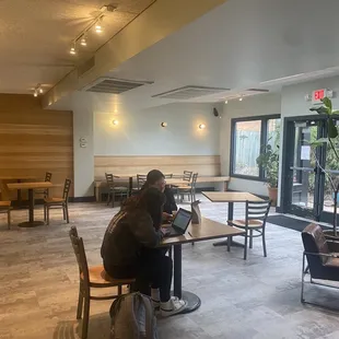two people sitting at tables