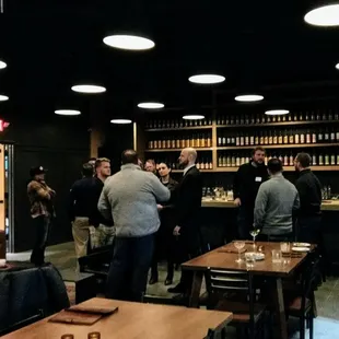 a group of people in a dimly lit room