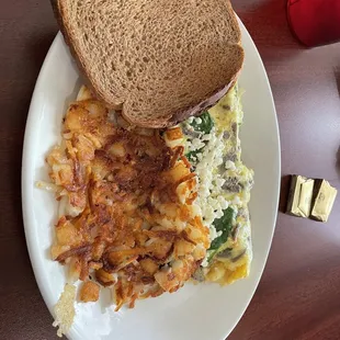 Gyro omelette with added spinach, hashbrowns, and wheat toast