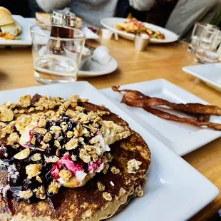 a stack of pancakes on a white plate