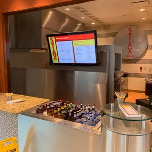 a woman sitting at a counter in a restaurant