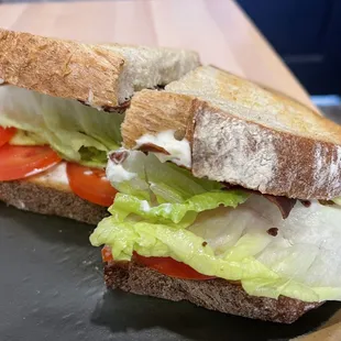 Bacon lettuce avocado and tomato sandwich.