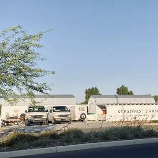 trucks parked in front of a building