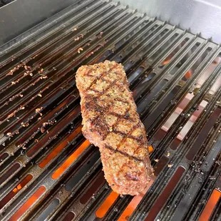 a steak on the grill