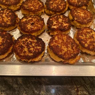 a pan full of meat patties